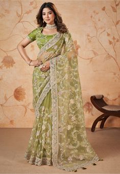 Net Scalloped Saree in Light Green This drape is Enhanced with Resham, Zari and Sequins Work Available with a Semi-stitched Art Silk Blouse in Light Green. Crafted in Round Neck and Short Sleeve Do note: 1.)Accessories shown in the image are for presentation purposes only. 2.)Slight variation in actual color vs. image is possible. Sequins Saree, Sequins Blouse, Dress Saree, Gorgeous Lady, Sequin Saree, Design Saree, Parrot Green, Modern Saree, Green Saree