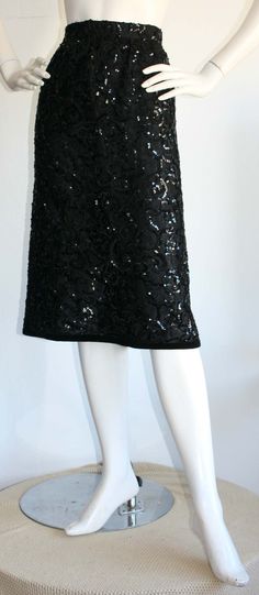 For Sale on 1stDibs - Beautiful vintage YSL 'Rive Gauche' black sequin skirt. The best black skirt for any fashionista's wardrobe! In great condition. Marked Size EU 44 Measurements: Glamorous Black Holiday Skirt, Glamorous Black Skirt For The Holidays, Glamorous Black Sequined Skirt, Evening Sequin Pencil Skirt, Elegant Black Skirt With Contrast Sequin, Fitted Sequin Pencil Skirt For Night Out, Black Knee-length Pencil Skirt For Evening, Chic Sequined Evening Pencil Skirt, Chic Evening Sequined Pencil Skirt