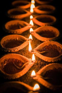 lit candles in clay bowls on a dark background royalty images for diwaling and decorating