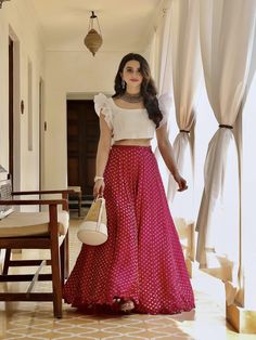 This raw silk white crop top with organza ruffles is paired with a with quirky pink banarasi skirt. Skirts For Wedding, Skirt And Crop Top Indian, Skirt And Top Indian, Crop Top Outfits Indian, Organza Ruffle Top, Latest Wedding Dress, Glamorous Gowns, Long Skirt And Top, Traditional Skirts