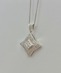 "Pacific Jewelry Presents, Star shape pendant with VS2 natural micro-set diamonds mounted in 18k solid white gold. Diamond weight (0.80 carats) is divided into 0.50 carats of princess cut center stones and 0.30 carats of adorning micro-pave diamonds. I really love this pendant, it's really so cute and sleek and the diamonds are all excellent/ideal cut diamonds for optimal sparkle and shine. Message me for certificate of appraisal with order. <> ✔ Natural, genuine diamonds ✔ Option to purch