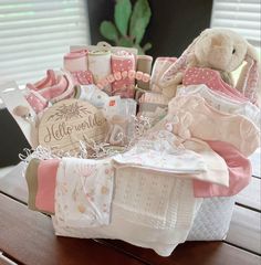 a basket filled with baby items on top of a wooden table