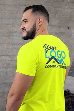 a man wearing a neon yellow t - shirt with your logo and company name on it