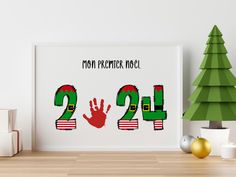 a christmas poster with the number twenty two and a handprinted santa clause on it