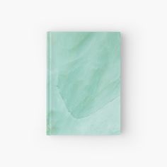 a green book with a white background