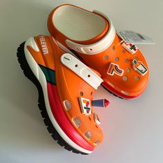 Nwt, Never Worn, Ready For Fast Shipping. Chunky Platforms With Light Up Jibbitz Charms. Limited Edition Trendy White Synthetic Clogs, Summer Streetwear Round Toe Clogs, Casual Orange Clogs With Round Toe, Casual Orange Round Toe Clogs, Casual Slip-on Clogs With Studded Rubber Outsoles, Casual Orange Clogs With Rubber Sole, Casual Studded Slip-on Clogs, Casual Platform Clogs For Streetwear, Casual White Platform Clogs