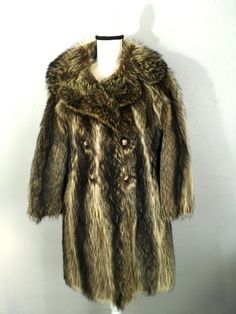 Vintage raccoon fur coat, double breasted,  with  fabulous raccoon fur collar.  Paisley satin lining has a zipped pocket & inner ties It has no size tg  Please note measurements: length from center back nape  35" chest  38" hip  38" sleeve from shoulder  20" sleeve from arm pit  15" shoulder to shoulder  19" Vintage Fur Coat For Winter Formal, Vintage Winter Fur Coat For Formal Occasions, Vintage Formal Fur Coat With Faux Fur Trim, Vintage Fur Coat For Winter Formal Occasions, Vintage Fur Coat For Formal Winter Occasions, Raccoon Fur Coat, Vintage Fox, Lady M, Fox Fur Coat