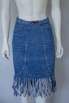 Vintage look Denim boğaziçi Skirt in size 38 Pencil Mini skirt. Very good condition. Good choise for urban style. All clothes are second hand with signs of natural wear .Do not expect them to look new,but they carry a lot of history in them. Lenght with the fringes:66cm Waist:36cm Hips:46cm Fitted Denim Blue Skirt With Frayed Hem, Fitted Denim Pencil Skirt With Frayed Hem, Fitted Pencil Skirt With Frayed Hem, Vintage Fitted Denim Skirt With Frayed Hem, Fitted Vintage Denim Skirt With Frayed Hem, Retro Fitted Dark Wash Skirt, Fitted Retro Dark Wash Skirt, Fitted Retro Skirt In Dark Wash, Retro Fitted Medium Wash Skirt