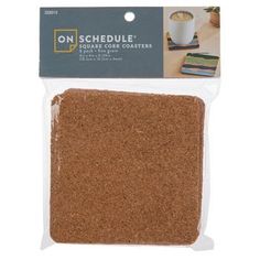 a package of brown cork coasters on a white background