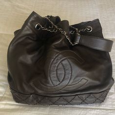 Chanel Dark Brown Large Drawstring Expandable Tote In Soft Lambskin Leather. 16” W, 11” H, 7” W. Comes With Original Box, Dust Bag, And Authenticity Card. Excellent Condition No Signs Of Wear. The Bag Is Gorgeous And Literally Like Brand New!! Not Your Avg Chanel. I Have Never Seen Another Like It, Large Cc On Front And Gorgeous Color-Lots Of Pockets. One Of A Kind!! I Have Tons Of Purses And Only Used A Couple Of Times! Large Chanel Bag, Selling On Poshmark, Chanel Bags, Vintage Colors, Lambskin Leather, Luxury Items, Chanel Bag, Laundry Bag, Dark Brown