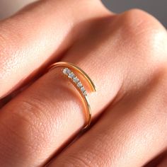 Our Gold Spiral Ring is an affordable simulant diamond ring as a perfect gift for women. As an adjustable open ring, this middle finger dainty ring offers a unique touch. Crafted in 18K, 14K and 10K gold, it's more than just a cuff ring. It's a versatile wrap and twist ring, boasting a multi-layered look. This is the best anniversary gift you are looking for your wife or girlfriend! This real solid gold cuff band is also a perfect gift that suits mother, sister, daughter and her, a reflection of Middle Finger Rings For Women, Gold Cuff Ring, Diamond Wrap Ring, Middle Finger Ring, Stackable Rings Wedding, Layered Rings, Spiral Ring, Cuff Ring, Wrap Ring