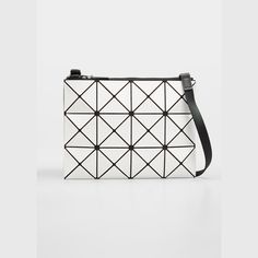 BAO BAO ISSEY MIYAKE "Lucent" faux-leather (PVC) geometric tile crossbody clutch. Adjustable shoulder strap. Lightweight, collapsible style for easy travel. Easy to clean (wipe with damp cloth); mesh lining. Recessed, extended zip top closure. Jacquard-lined interior. One zip pocket. 9"H x 13.4"W x 2"D. Made in Japan. Luxury Geometric Shoulder Bag With Removable Pouch, Luxury Geometric Bag With Removable Pouch, Luxury Bag With Removable Geometric Pouch, Luxury Geometric Shoulder Bag For Everyday Use, Modern Geometric Shoulder Bag With Removable Pouch, Geometric Leather Travel Shoulder Bag, Geometric Leather Shoulder Bag For Travel, Modern Geometric Shoulder Bag For Travel, Modern Geometric Travel Shoulder Bag