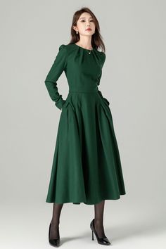 "Green long sleeve wool swing dress with a stylish folded neckline. This dress effortlessly blends elegance and comfort. The flared silhouette offers a graceful and flattering fit, while the high-quality wool fabric ensures warmth and softness. The folded neckline adds a touch of sophistication to this versatile dress, perfect for various occasions. DETAIL * 30% wool, 30% fiber, 40% polyester * fully satiny lining, more nice to the touch body * Round pleated neckline * Long sleeves * Fit and fla Formal Dresses For Fall, Long Sleeve Pleated Wedding Dress, Fitted Long Sleeve Fall Wedding Dress, Fall Wedding Pleated Dress, Fall Wedding Dress With Pleated Details, Chic A-line Long Sleeve Wedding Dress, Fitted Long Sleeve A-line Dress For Winter, Fitted A-line Long Sleeve Winter Dress, Winter Pleated Long Sleeve Dress