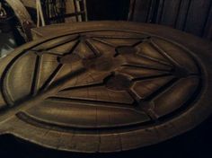 a large metal object sitting on top of a wooden table