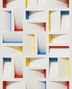 an abstract pattern made up of squares and rectangles in white, blue, red, yellow and orange