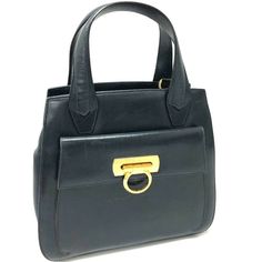 ▶ITEM NO. 16037-14705-3 ▶NAME Salvatore Ferragamo Gancini Tote Bag Hand Bag ▶COLOR Navy ▶MMATERIAL Leather ▶APPROX SIZE W8.5 x H9.8 x D4.3inch / W21.5cm x H25cm x D11cm The width is measured at the top. ▶Gender Women's ▶Spec [Outside] Turn Lock pocket x 1 [Inside] Zipper pocket x 1 ▶ADDITIONAL ITEMS None ▶ITEM RANK Used B Rank ▶CONDITION DETAILS Outside:Scratches,Stain,Wrinkles Shape:Losing Shape,There is a dent Inside:Scratches,Wrinkles Metal fittings part:Scratches,Stain,Fading,dullness Powder Ferragamo Gancini Bag, Navy Leather, Gothic Fashion, Hand Bag, Salvatore Ferragamo, Luxury Branding, Leather Tote, Zipper Pocket, Clutch Bag