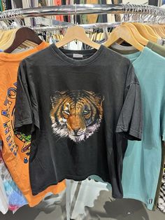 Vintage 90s American Brand Tiger Head Graphic Black T-Shirt Size XL Please view the photos and description in order to judge condition for yourself; Width: 20" Length: 26" All sales are final.  If you have any questions or concerns, contact us. Thank you! Tiger Tshirt, Tiger Shirt, Tiger Head, Tiger T Shirt, American Brand, Black T Shirt, Vintage 90s, Black Tshirt, Mens T