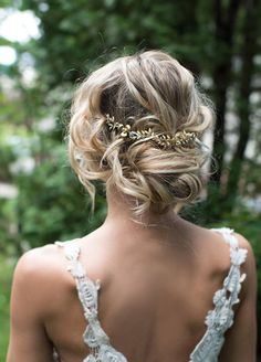 the back of a woman's head wearing a wedding dress