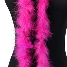 a pink feather scarf on a mannequin