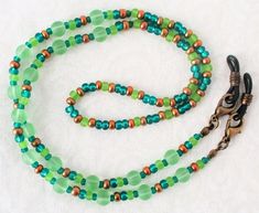 Green Brown Beaded Eyeglass Chain - Juicybeads Jewelry Adjustable Green Necklace For Everyday Use, Everyday Adjustable Green Necklace, Everyday Round Beaded Necklaces With Lobster Clasp, Adjustable Colorful Beaded Jewelry For Everyday Use, Adjustable Round Beaded Necklaces For Everyday, Adjustable Beaded Chain Necklace For Everyday, Adjustable Round Bead Glass Necklaces, Adjustable Green Beaded Necklaces With Lobster Clasp, Adjustable Czech Glass Beaded Necklaces With Lobster Clasp