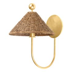 a wall light with a straw shade on it's face and a gold metal hook