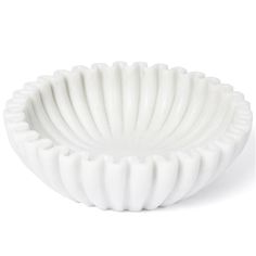 a white bowl sitting on top of a table