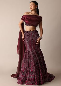 Featuring our whimsical wine jeweled lehenga paired with a stylized blouse that is a beautiful amalgamation of opulence and charm. Accented with sparkly jewels this fish cut silhouette wraps your curves with elegance and grace. The stylized blouse elevated with feminine trail draping and wide neck fit complete this grandeur effortless look. Dry clean only if required. Slight variation in color is possible due to digital photography. Indo Western Silhouettes, Fishcut Lehenga Pattern, Roka Outfits, Fish Cut Lehenga, Sangeet Dress, Indo Western Lehenga, Sari Blouses, Fish Cut, Wedding Fits