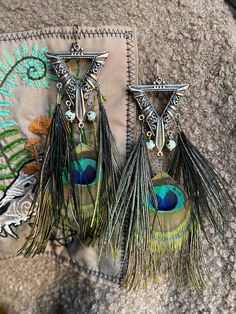 Rain forest witch theme jewelry, copper details, Jasper stone beads, Peacock Feathers, boho style jewelry, earrings, pagan jewelry, tribal jewelry, summer attribute. The feathers were collected without cruelty. Handmade Bohemian Copper Jewelry, Handmade Copper Bohemian Jewelry, Bohemian Wire Wrapped Jewelry, Green Bohemian Feather Earrings, Bohemian Green Feather Earrings, Green Bohemian Earrings With Feathers, Bronze Bohemian Earrings For Festivals, Green Hippie Festival Jewelry, Hippie Green Festival Jewelry