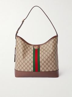 Thanks to its roomy, soft shape, Gucci's 'Ophidia' bag will easily fit a book, tablet and wallet with space to spare. It's made from hardwearing coated-canvas with brown leather and webbing trims. The strap can easily be adjusted to your preferred, most comfortable drop. Gucci Shoulder Bag With Leather Trim And Monogram Canvas, Gucci Monogram Canvas Shoulder Bag With Leather Trim, Gucci Shoulder Bag With Leather Trim, Gucci Top Handle Shoulder Bag With Leather Trim, Gucci Leather Shoulder Bag With Leather Trim, Gucci Canvas Bags With Gold-tone Hardware, Gucci Canvas Shoulder Bag With Leather Trim, Gucci Brown Shoulder Bag With Leather Trim, Everyday Gucci Shoulder Bag With Leather Trim