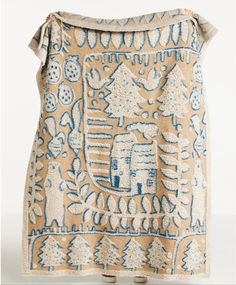 an old cloth with blue and white designs on it