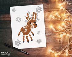 a christmas card with an image of a handprinted reindeer