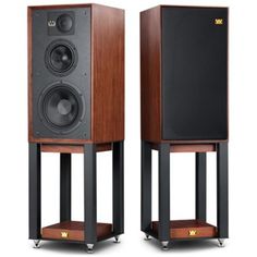 two wooden speakers sitting side by side on top of each other in front of a white background