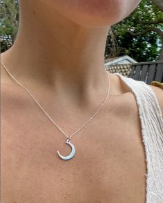 1.7 cm Recycled silver Crescent Moon pendant, stamped in homage to the beautiful moon. 44 cm Boston chain short necklace.  Handmade in Toronto, ON The silver is recycled (in an environmentally responsible way) from electronics, which contributes over 70% of toxicity to landfills, despite representing only 7% by volume. This highly regulated process takes place in Canada and the USA. This recycled silver is a higher grade than conventional sterling silver. It has a higher percentage of silver to copper, is nickel-free and contains germanium, a base metal that prevents oxidization.  The pieces are crafted to the highest standard, with all jump rings soldered shut, and all components work-hardened for hours.  For these reasons, you can confidently wear this piece every day: in the shower, whi Minimalist Handmade Moon Necklaces, Sterling Silver Moon Charm Necklace For Everyday, Everyday Sterling Silver Charm Necklace With Moon Charm, Everyday Moon Shape Sterling Silver Charm Necklace, Everyday Moon Shaped Sterling Silver Charm Necklace, Everyday Sterling Silver Moon Charm Necklace, Minimalist Everyday Necklaces With Moon Phase, Minimalist Sterling Silver Moon Necklace, Minimalist Silver Half Moon Necklace