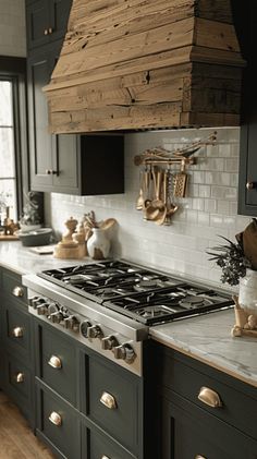 a stove top oven sitting inside of a kitchen next to wooden cabinets and counter tops