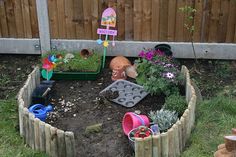 a garden filled with lots of plants and toys