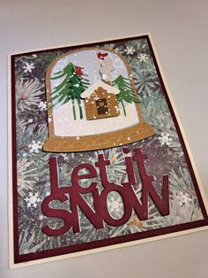 a christmas card with the words let it snow and a gingerbread house on top