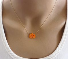 Unique gift This adorable necklace made with Opal pumpkin charm and a delicate sterling silver / gold filled chain. Necklace features: - Pumpkin pendant 15mm - All components are 100% sterling silver / Gold filled Comes beautifully wrapped and ready for gift giving! Enter Shop here: OpaLand.etsy.com. Thank you so much for looking ♥ Halloween Gift Clavicle Chain Jewelry, Halloween Clavicle Chain Jewelry Gift, Orange Necklace For Halloween Gift, Halloween Necklace With Adjustable Chain And Pendant, Halloween Pendant Necklaces With Adjustable Chain, Halloween Pendant Necklace Gift, Thanksgiving Necklace, Pumpkin Necklace, Jewelry Halloween