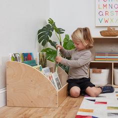 Book Displays let little ones see all of their favorite books on display in easy-to-reach shelves that make story time simple. The Toddler Book Display is perfect for displaying and storing extra tall books for little ones. Each display pocket stores progressively larger books; starting from the first pocket which is 7" deep, then 9.5", 11", and finally a back book pocket that is 13" deep for your tallest toddler books. Use this bookcase's low, forward-facing shelves keep all of your kid's favor Toddler Room Book Storage, Montessori Book Shelf, Preschool Reading Nook, Toddler Reading Corner, Kids Book Storage Ideas, Kid Bookshelf, Otroška Soba, Book Crate, Montessori Toddler Rooms