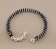 Fabulous 2.5 mm small black beaded 925 sterling silver handmade bracelet, amazing2 line or layer bracelet. Metal-925 sterling silver. Item type-Beaded bracelet.(we can use as anklet also) Beads size-2.5 mm. Length-6 to 11 inches. Stamped-925. weight-3.5 grams for 7 inches.(weight and price will be vary as per length) Make excellent gifting and collectible pieces(gift for birthday, wedding, anniversary, mother's day, fathers day, Christmas day,) We take absolute care of precious jewels are packed Black Beaded Sterling Silver Bracelets, Black Sterling Silver Bracelets With Silver Beads, Minimalist Silver Beaded Bracelet With Black Beads, Minimalist Black Sterling Silver Beaded Bracelets, Black Beaded Bracelet, Black Beaded Bracelets, Precious Jewels, Layered Bracelets, Black Beads