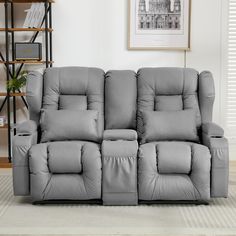 a grey reclining sofa in a living room