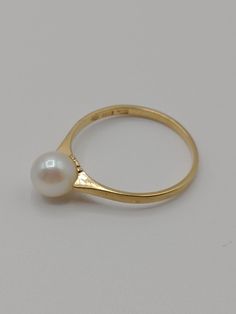 An absolutely stunning 18 carat gold and pearl ring by Ceson of Gothenburg, Sweden and made in 1996. The ring is in excellent condition. It is fully hallmarked K & EC for Ceson,  G for the town mark of Gothenburg,  cat paw, 18 k for 18 carat gold and X10 for the year 1996.  Measurements UK ring size N Weight 2 grams Timeless Formal Pearl Ring, Formal Yellow Gold Rings With High Luster, Formal High Luster Yellow Gold Rings, High Luster Yellow Gold Rings For Formal Occasions, Formal 14k Gold Pearl Ring With 17 Jewels, Formal High Luster Yellow Gold Pearl Ring, Formal Yellow Gold Pearl Ring With High Luster, White Pearl Ring With 17 Jewels For Formal Occasions, Timeless Pearl Drop Rings For Formal Occasions