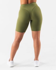 HIGHLIGHTS. 7" inseam High rise Buttery soft High sweat FIT SUGGESTION. This item runs true to Alphalete's tight fit... Brittney is 5’2”/157.5cm, wearing a size S. with 26"/66cm waist and 37"/94cm hips. MATERIALS AND WASHING DIRECTIONS. 69% Nylon, 31% Spandex. We recommend washing inside-out on a cold setting. Hang to dry DESCRIPTION Extreme high stretch meets a buttery soft hand-feel to make this fabric the perfect ten. No front seam and a double layer front panel, for added compression and com Fitted Biker Shorts With 5-inch Inseam For Gym, Sporty Fitted Biker Shorts With 5-inch Inseam, Green High Stretch Short Activewear, Green Fitted Go-dry Leggings, Fitted Green Leggings With Go-dry Technology, High Stretch Sweat-resistant Short Activewear, High Stretch Green Athletic Shorts For Training, High Stretch Green Athletic Shorts For Workout, Fitted Shorts With Light Support