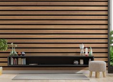 a living room scene with focus on the tv and wall coverings that have vertical slats