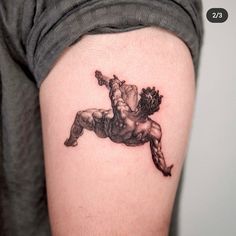 a man with a tattoo on his arm