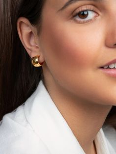 Elevate your style with our Gold Textured Hoop Earrings. Made from 100% real gold, these earrings boast a unique textured design for a timeless yet modern look. Perfect for any occasion, these earrings will add a touch of elegance and sophistication to any outfit.