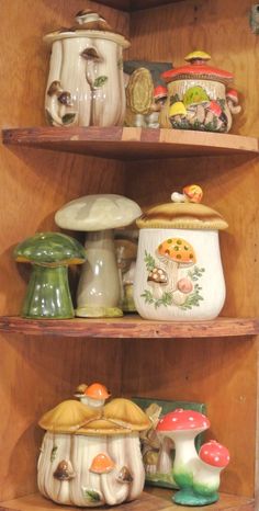 the shelves are filled with different types of pottery