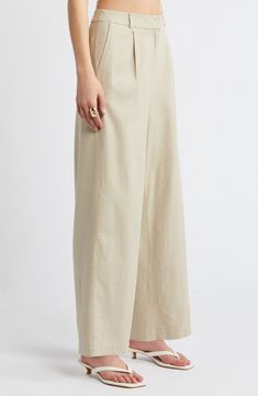 On-trend wide legs lend sophisticated drama to lightweight linen-blend pants designed with a crisp pleated front. 29" inseam; 20 1/2" leg opening; 12" front rise; 16" back rise (size 8) Zip fly with hook-and-bar closure Front slant pockets 53% linen, 44% rayon, 3% spandex Machine wash, tumble dry Imported Spring Modern Wide Leg Pants, Classic Summer Linen Wide Leg Pants, Loosely Fitted Classic Wide Leg Pants For Summer, Classic Full-length Linen Wide Leg Pants, Classic Full Length Linen Wide Leg Pants, Classic Full Length Wide Leg Linen Pants, Spring Neutral Linen Wide Leg Pants, Formal Neutral Wide Leg Pants For Spring, Spring Formal Neutral Wide Leg Pants