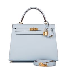 Photos are a representation of the bag sourced. This Kelly, in the Sellier style, is in Bleu Brume epsom leather with gold hardware and has tonal stitching, front flap, two straps with center toggle closure, clochette with lock and two keys a single rolled handle and removable shoulder strap.The interior is lined with Bleu Brume chevre leather and has one zip pocket with an Hermes engraved pull and one open pocket on the opposite side.Origin: FranceCondition: Pristine; new or never (plastic on h Hermes Kelly Sellier, Kelly Sellier, Hermes Box, Hermes Bags, Designer Bag, Leather Satchel, Blue Leather, Gold Hardware, Luxury Bags