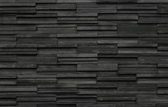 a wall made out of black wood planks