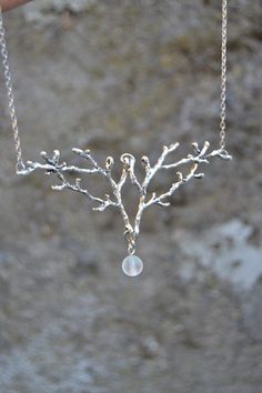 PLEASE read my shop announcement before placing an order so you know what to expect right now. Plus, when ordering from outside Europe, don't forget to provide a phone number for the courier to ensure the fastest and smoothest delivery. Magical silver antler or branch necklace with iridescent white bead, color changing, inspired by the most witchy Silvan elves and the Magic of the woods. These pretty whimsical beads change their tones depending on the light they receive. Sometimes they look just Ethereal Adjustable Necklaces For Gifts, Unique Silver Clavicle Chain Jewelry, Unique Silver Jewelry With Clavicle Chain, Ethereal Silver Dangle Jewelry, Nature-inspired Metal Jewelry For Gifts, Nature-inspired Metal Jewelry For Gift, Nature-inspired Metal Jewelry For Gifting, Handmade Ethereal Dangle Jewelry, Ethereal Sterling Silver Pendant Jewelry